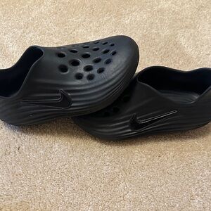 Nike Black Perforated Slip-Ons